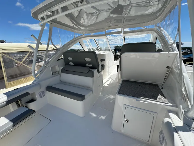 Slide: The Image of 2023 Albemarle 31 Dual Console boat interior with seating and storage compartments. - 4