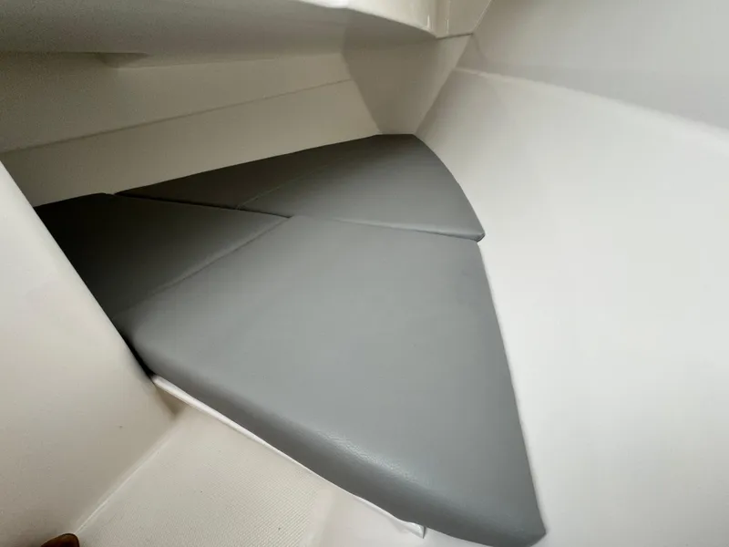 Slide: The Image of 2023 Albemarle 31 Dual Console interior seating area with gray cushions. - 9