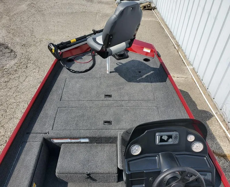 Slide: The Image of 2023 Lowe Skorpion 17 fishing boat interior with seating and control panel. - 4