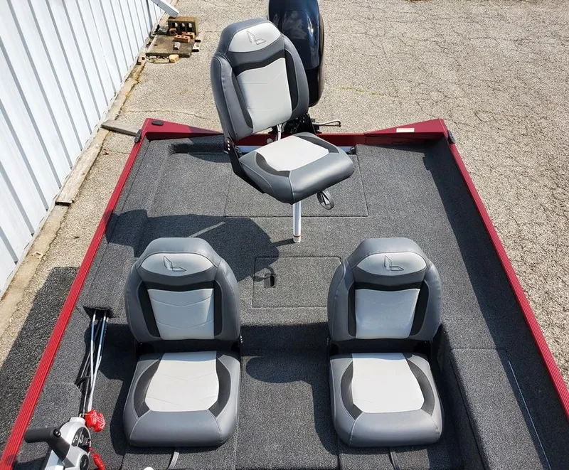 Slide: The Image of 2023 Lowe Skorpion 17 boat interior with three gray and white seats. - 7