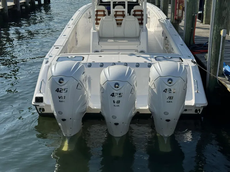 Slide: The Image of 2024 Everglades 395 Center Console boat with triple 425 V8 engines docked. - 12