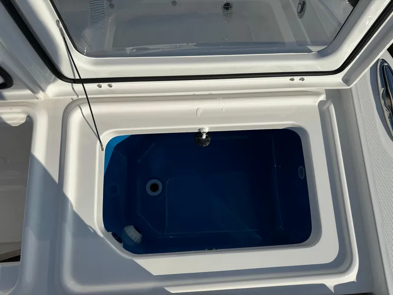 Slide: The Image of 2024 Everglades 395 Center Console livewell with open lid, showcasing interior. - 19