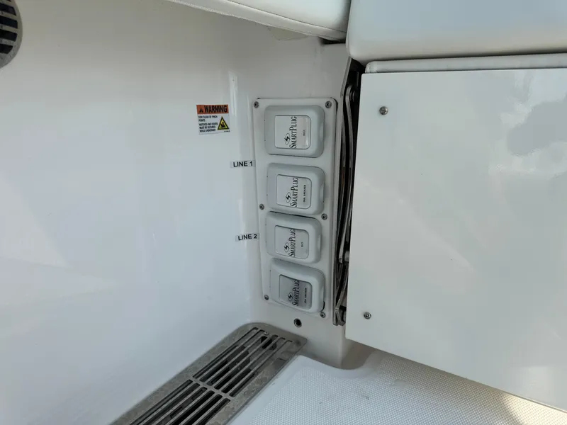 Slide: The Image of 2024 Everglades 395 Center Console electrical panel with labeled switches. - 22