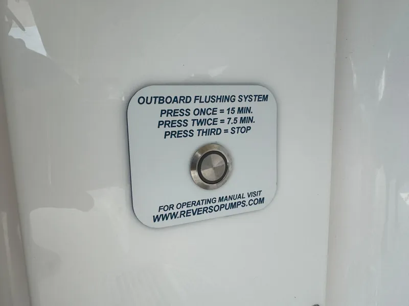 Slide: The Image of Outboard flushing system button on 2024 Everglades 395 Center Console boat. - 23