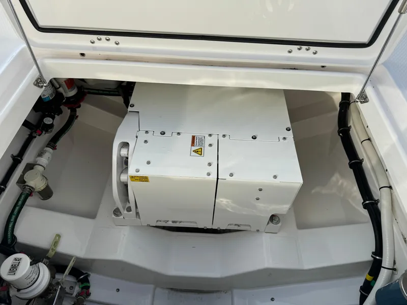 Slide: The Image of 2024 Everglades 395 Center Console engine compartment, showcasing modern design and equipment. - 25