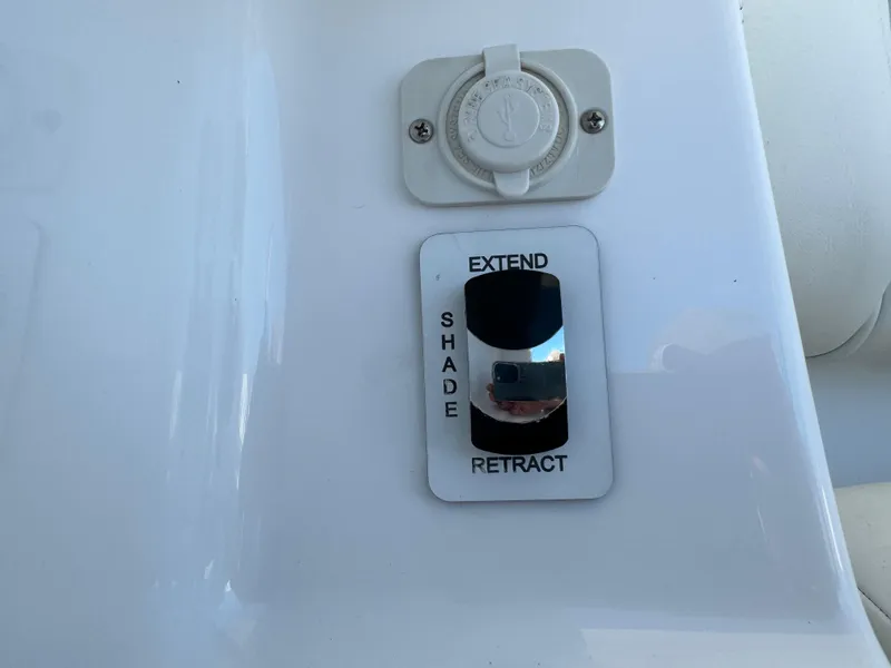 Slide: The Image of Shade control switch on 2024 Everglades 395 Center Console boat. - 35