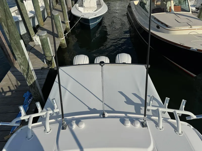 Slide: The Image of 2024 Everglades 395 Center Console boat docked at marina. - 37