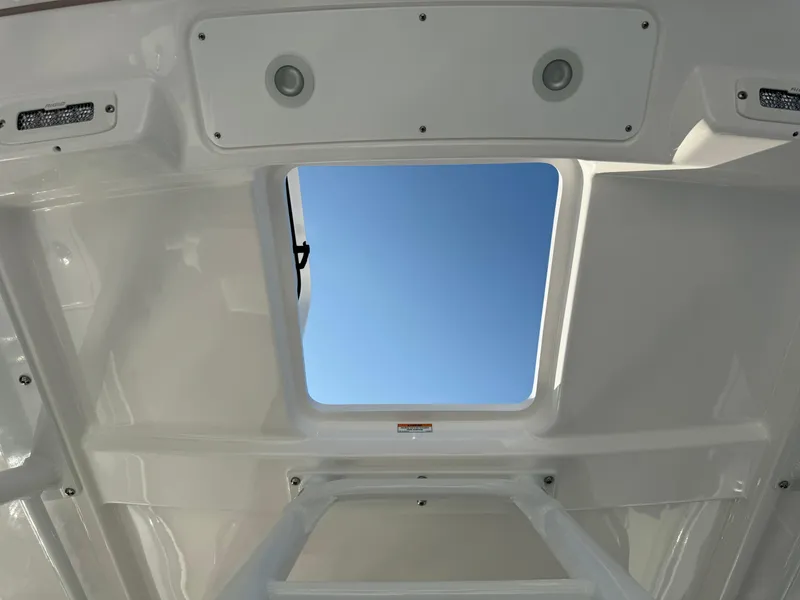 Slide: The Image of View through the sunroof of a 2024 Everglades 395 Center Console boat. - 47