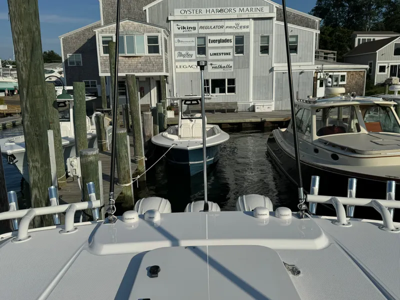 Slide: The Image of 2024 Everglades 395 Center Console at marina, docked near Oyster Harbors Marine. - 49