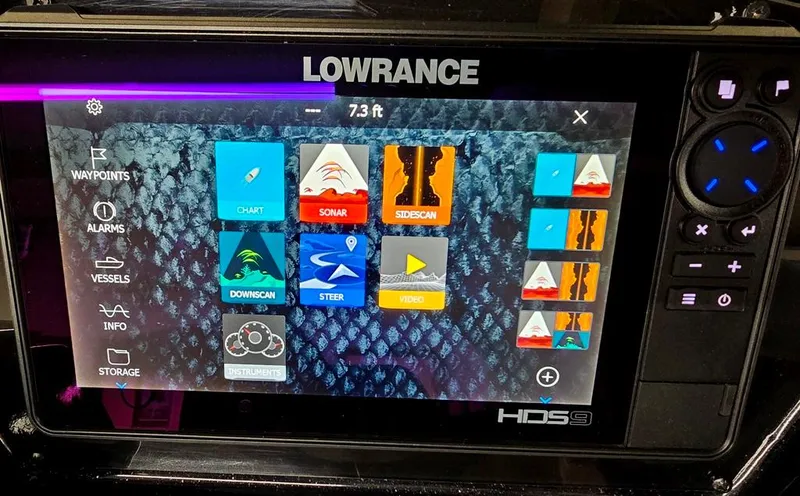 Slide: The Image of Lowrance HDS9 display on 2023 Lowe Stinger 188, showing navigation and sonar features. - 13