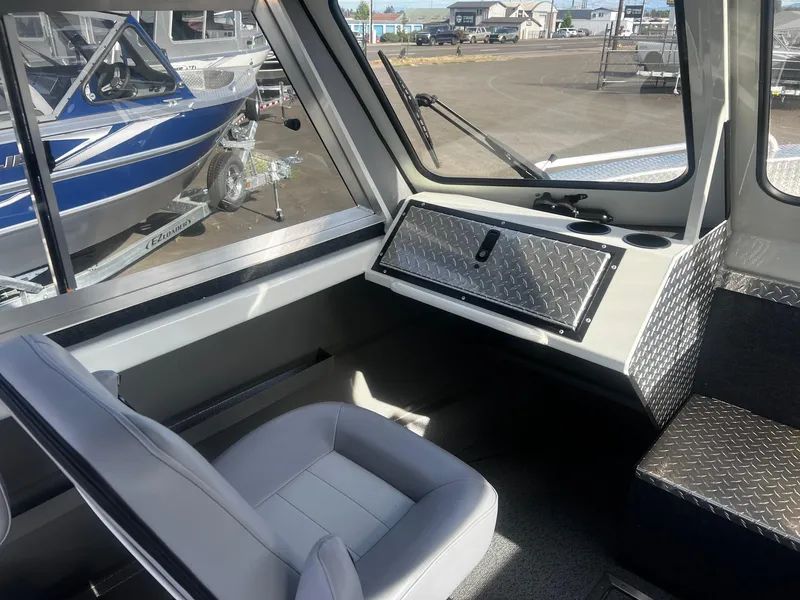 Slide: The Image of Interior of 2023 Thunder Jet 21 Chinook OS boat with seating and dashboard. - 10