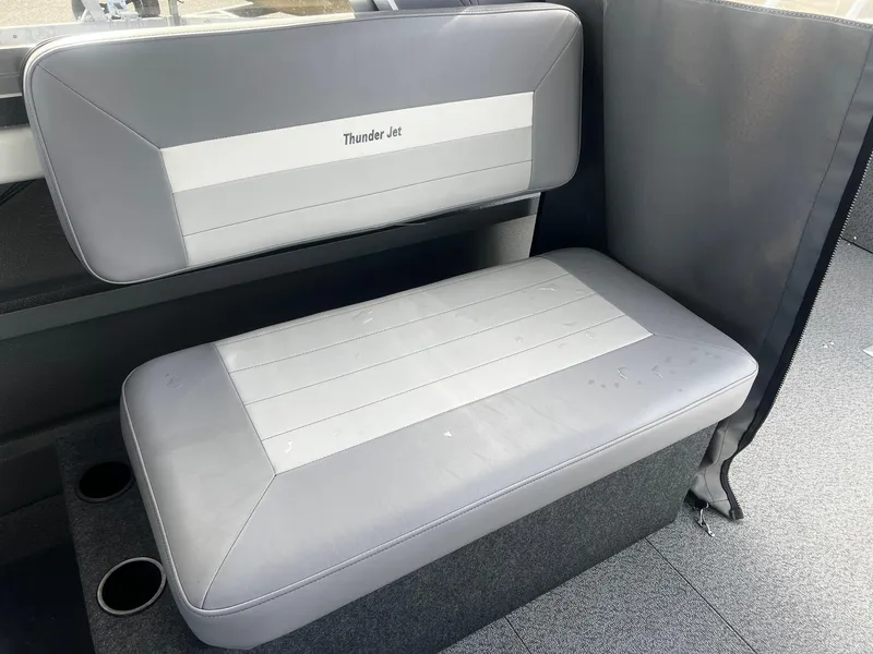 Slide: The Image of 2023 Thunder Jet 21 Chinook OS boat interior with gray seating and cup holders. - 13
