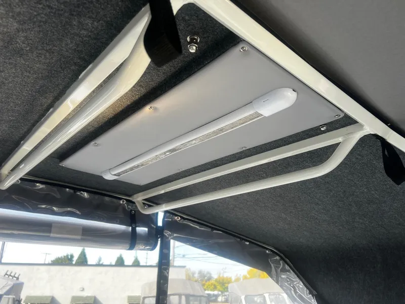 Slide: The Image of Interior view of 2023 Thunder Jet 21 Chinook OS boat ceiling with lighting fixture. - 16