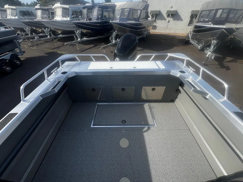 Slide: The Image of 2023 Thunder Jet 21 Chinook OS boat interior with multiple boats in the background. - 17