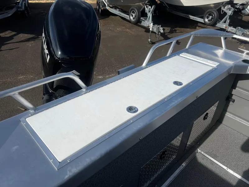 Slide: The Image of 2023 Thunder Jet 21 Chinook OS boat deck with motor and railing. - 18