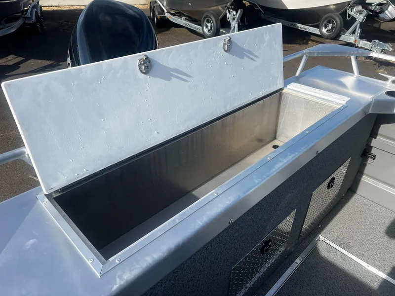 Slide: The Image of 2023 Thunder Jet 21 Chinook OS boat storage compartment open, showcasing spacious interior. - 19