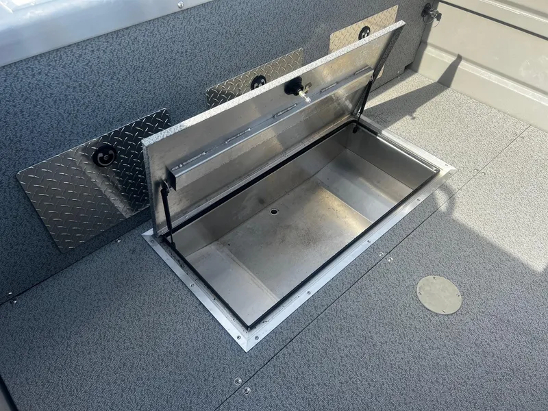 Slide: The Image of 2023 Thunder Jet 21 Chinook OS boat storage compartment, open and empty. - 21