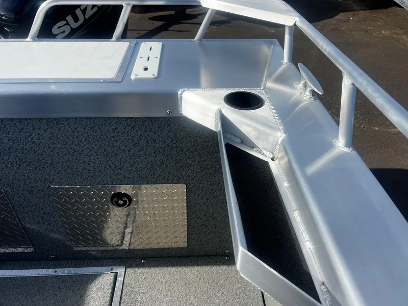 Slide: The Image of 2023 Thunder Jet 21 Chinook OS boat interior with storage compartments and railing. - 22