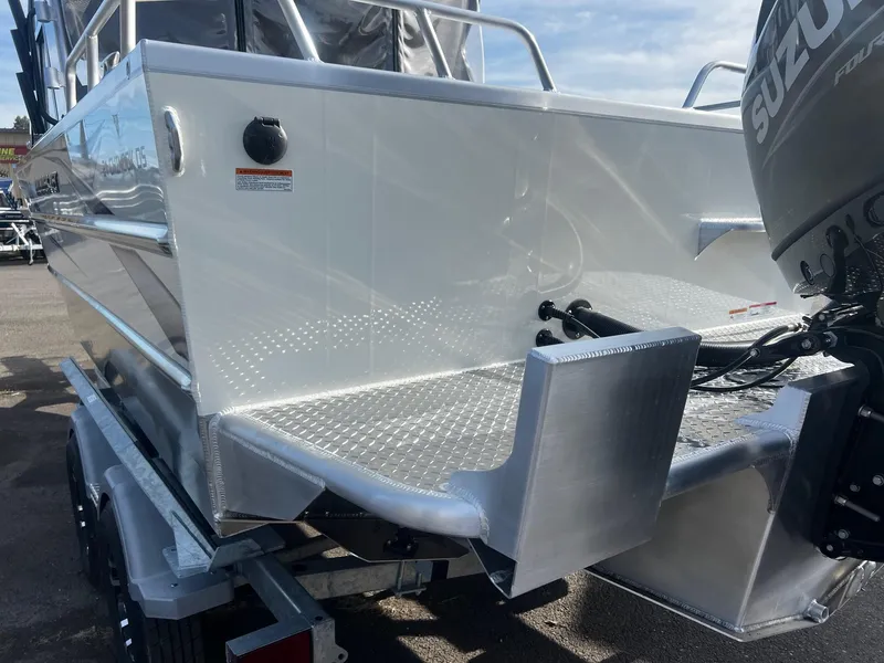 Slide: The Image of 2023 Thunder Jet 21 Chinook OS boat with Suzuki outboard motor, rear view. - 23