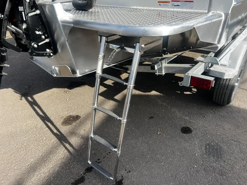 Slide: The Image of 2023 Thunder Jet 21 Chinook OS boat with foldable ladder on trailer. - 24
