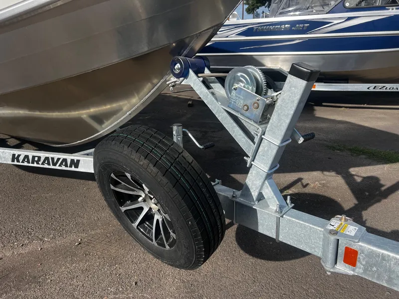 Slide: The Image of 2023 Thunder Jet 21 Chinook OS boat on Karavan trailer, close-up of wheel and winch. - 26