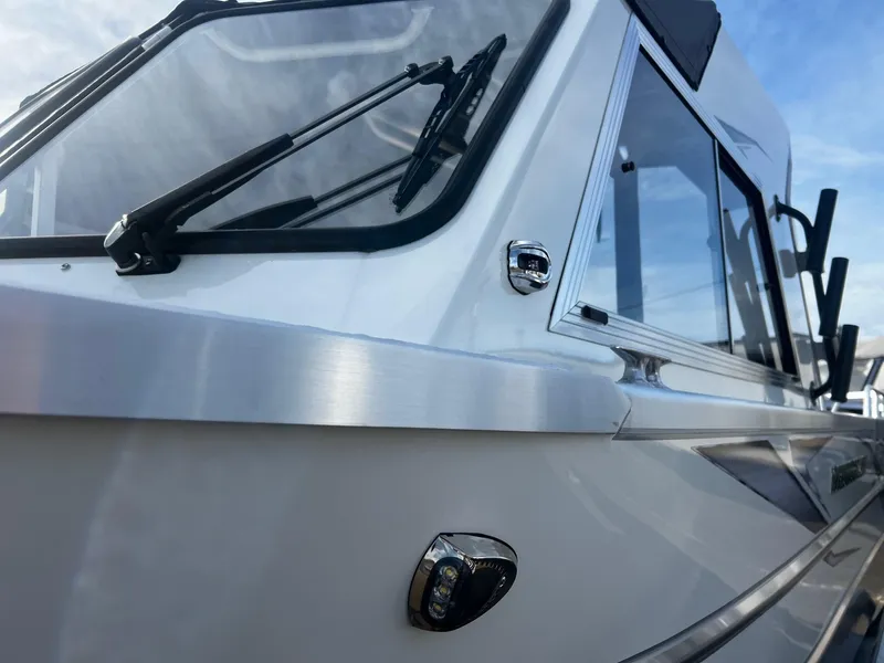 Slide: The Image of 2023 Thunder Jet 21 Chinook OS boat, sleek design with windshield and side windows. - 28