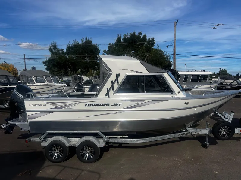 Slide: The Image of 2023 Thunder Jet 21 Chinook OS boat on trailer, parked outdoors. - 5