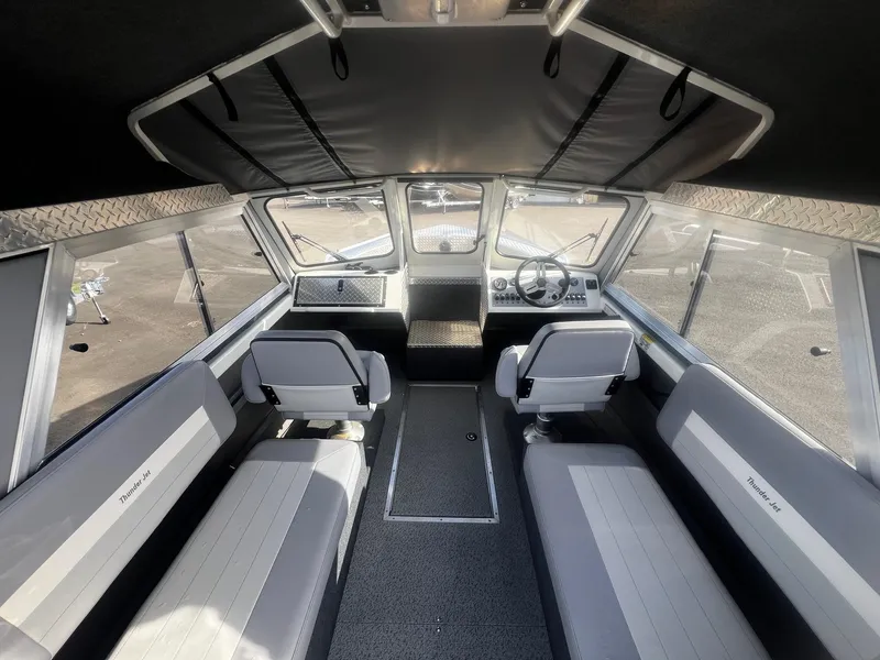 Slide: The Image of Interior of 2023 Thunder Jet 21 Chinook OS boat, featuring spacious seating and modern design. - 7