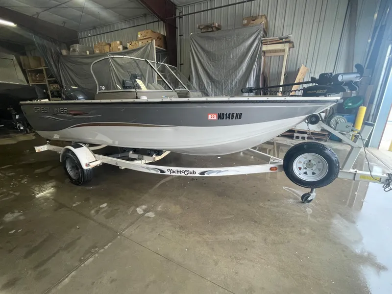 Slide: The Image of 2004 Crestliner 1700 SUPER HAWK boat on trailer in garage setting. - 1