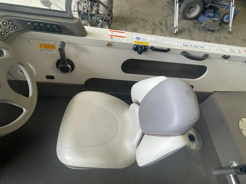 Slide: The Image of 2004 Crestliner 1700 SUPER HAWK dashboard with steering wheel, gauges, and fishfinder. - 10