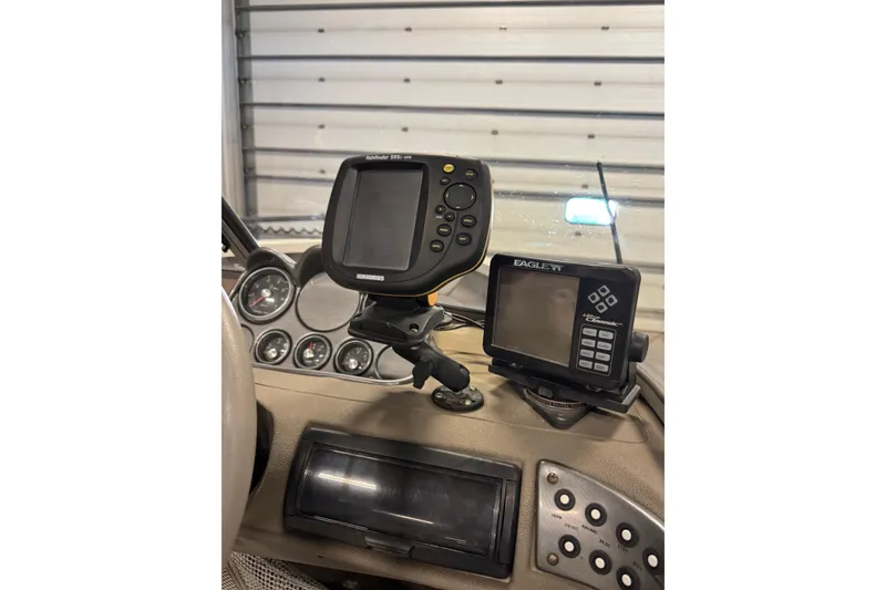 Slide: The Image of Dashboard of 2004 Crestliner 1700 SUPER HAWK with fishfinder and navigation equipment. - 17