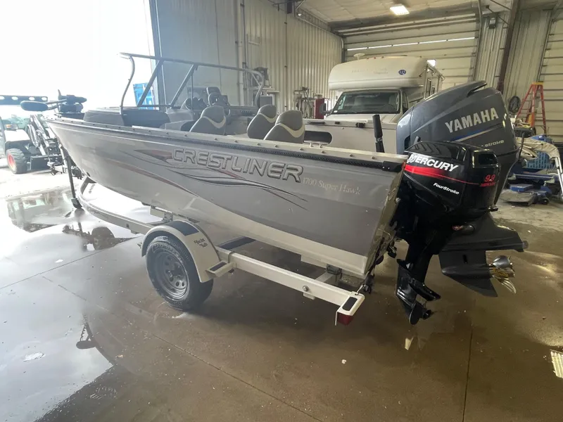 Slide: The Image of 2004 Crestliner 1700 Super Hawk boat with Yamaha outboard motor in a garage. - 3