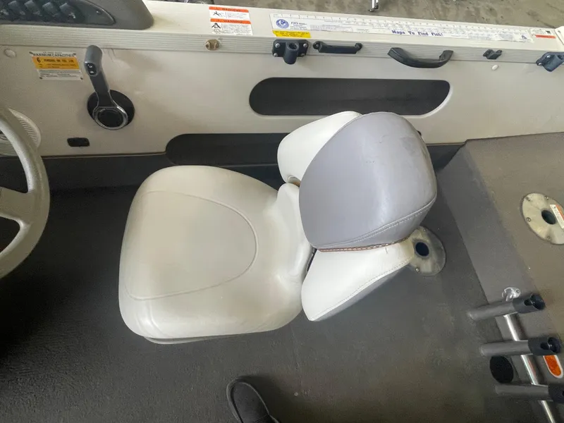 Slide: The Image of 2004 Crestliner 1700 SUPER HAWK boat dashboard with steering wheel and navigation equipment. - 9