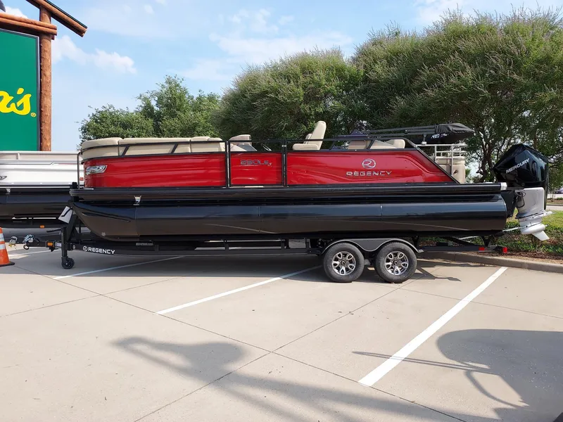 The Image of 2023 Regency 230 LE3 Sport pontoon boat in parking lot. - 0