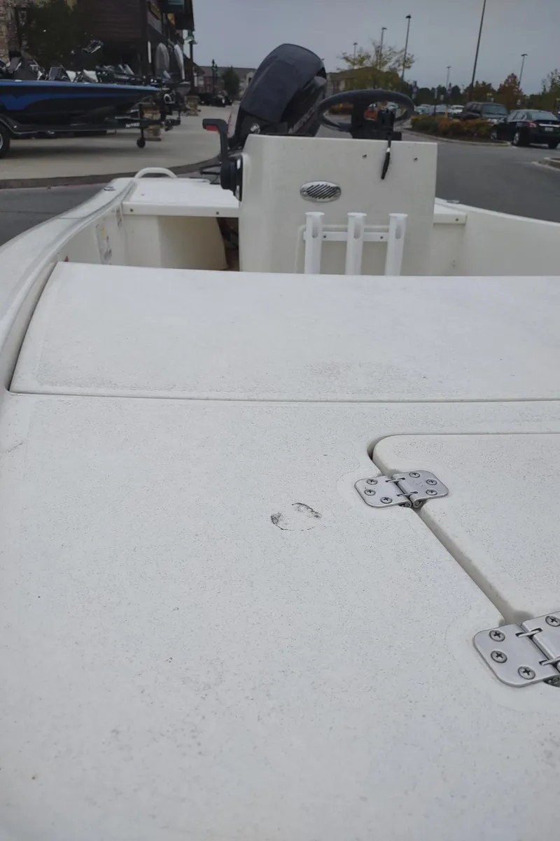 Slide: The Image of 2023 Mako Pro Skiff 13 CC boat, white deck, outdoor display. - 5