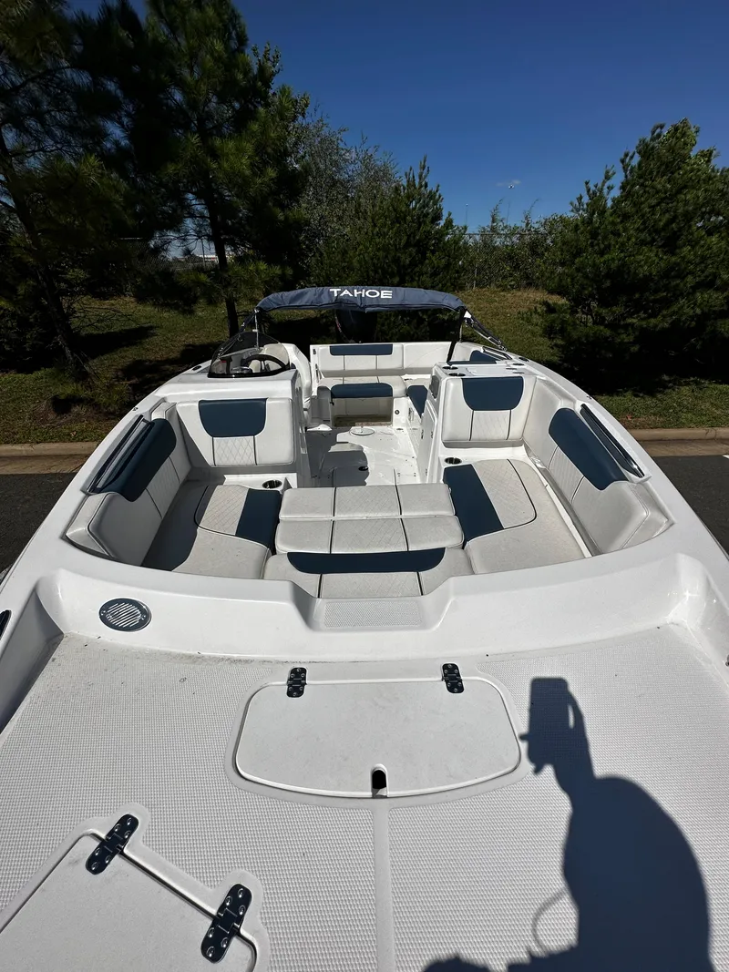 Slide: The Image of 2023 Tahoe 1950 boat with spacious seating and modern design. - 2