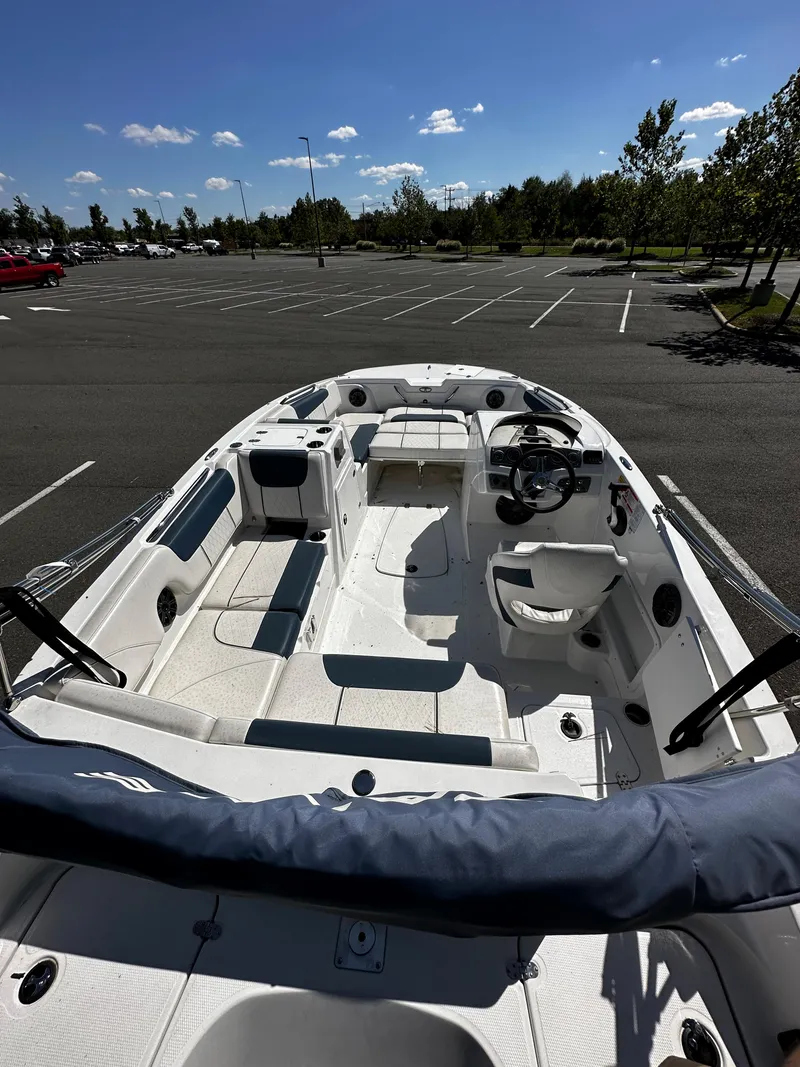 Slide: The Image of 2023 Tahoe 1950 boat in an empty parking lot. - 3
