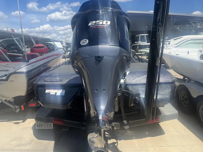 Slide: The Image of 2021 Skeeter ZXR 20 boat with 250 horsepower engine, parked in a marina. - 3