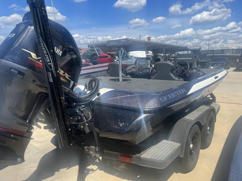 Slide: The Image of 2021 Skeeter ZXR 20 boat with Yamaha engine in a marina under a sunny sky. - 4