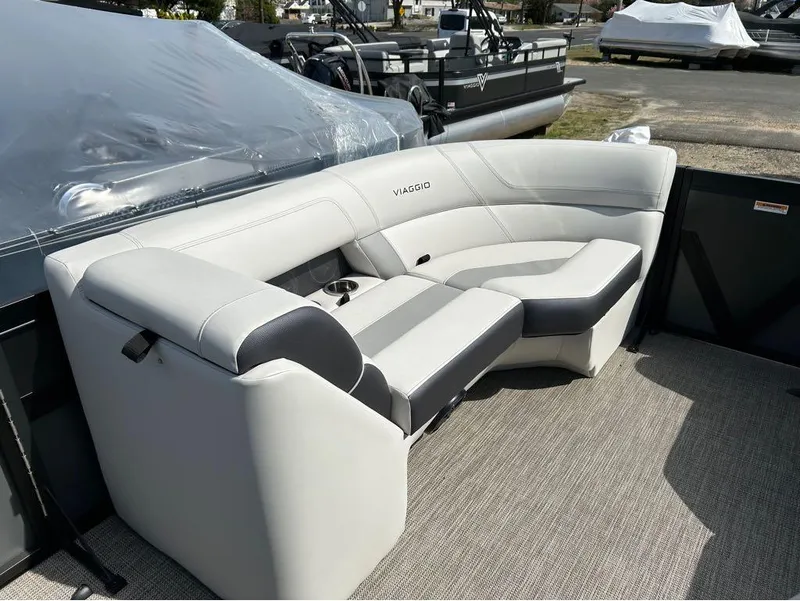 Slide: The Image of Viaggio D23U 2023 boat seating with gray upholstery and cup holders. - 13