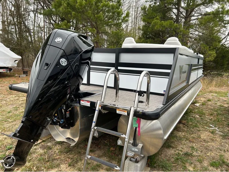 Slide: The Image of 2023 Viaggio D23U pontoon boat with powerful outboard motor in a wooded area. - 9