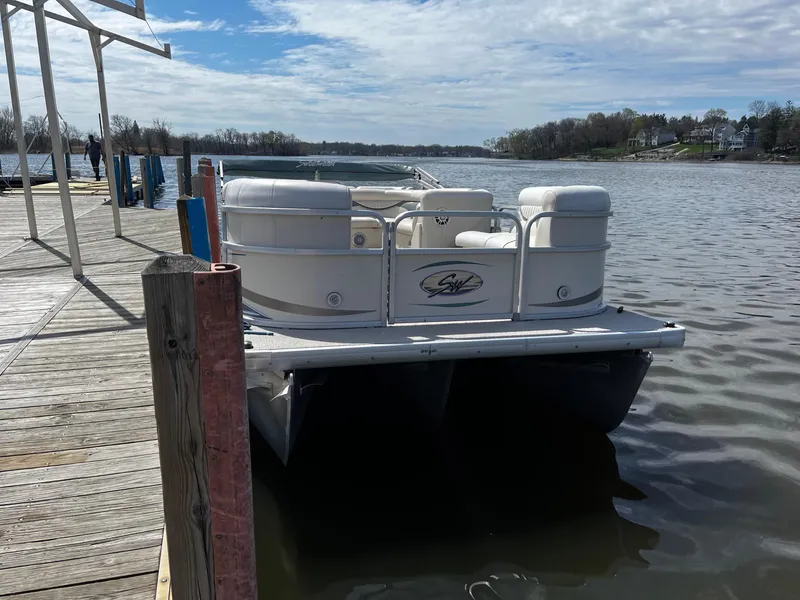 Slide: The Image of 2008 Sweetwater SW2186RE4 pontoon boat docked on a calm lake. - 3