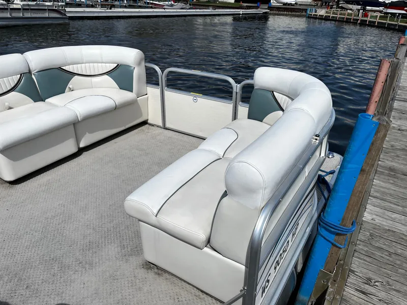 Slide: The Image of 2008 Sweetwater SW2186RE4 pontoon boat with white seating at a dock. - 5