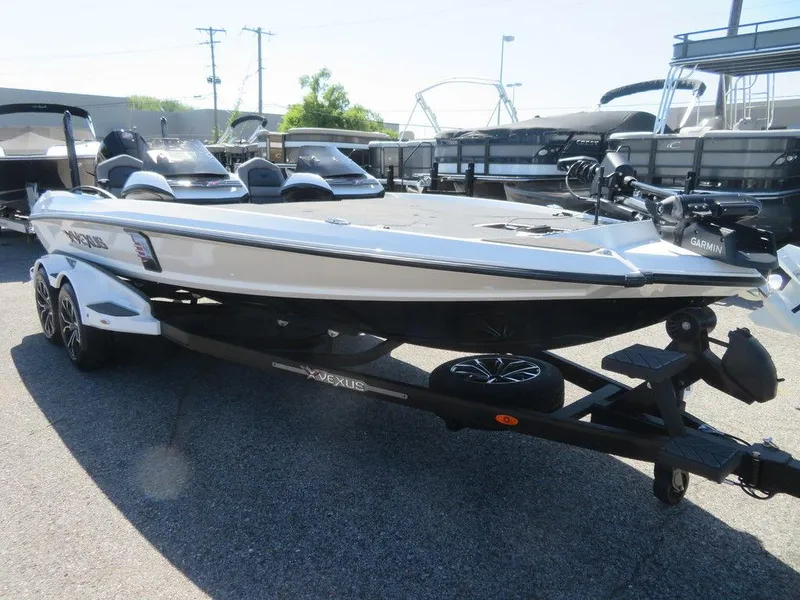 Slide: The Image of 2023 Vexus VX20 boat on trailer in marina. - 10