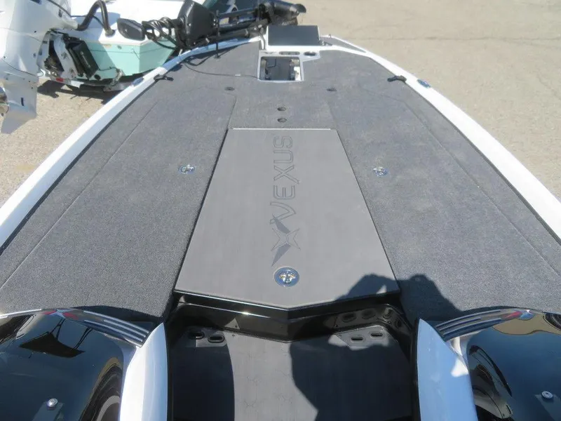 Slide: The Image of 2023 Vexus VX20 boat deck with storage compartments and sleek design. - 14