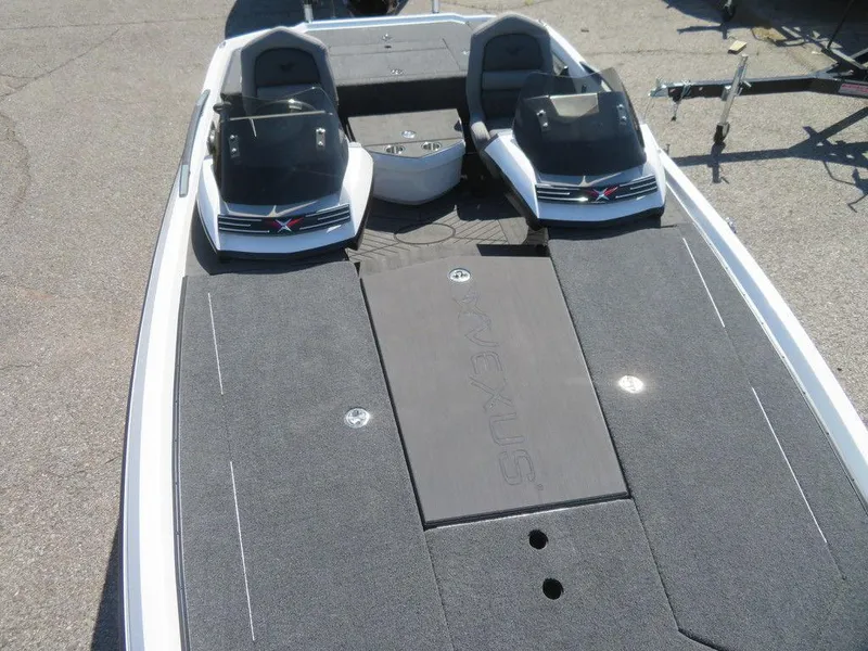 Slide: The Image of 2023 Vexus VX20 boat interior with dual consoles and spacious deck. - 16