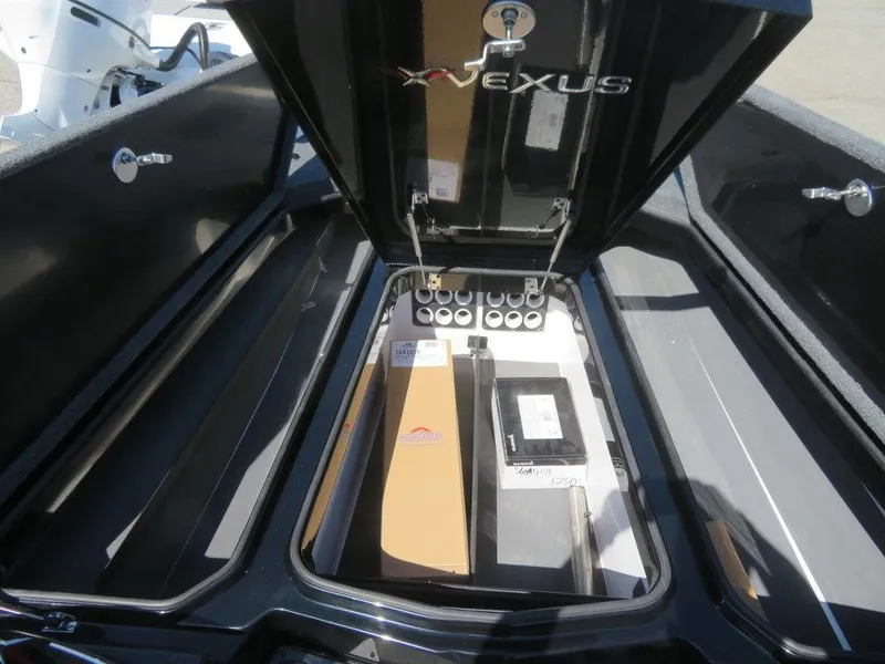 Slide: The Image of 2023 Vexus VX20 boat storage compartment with open lid. - 20