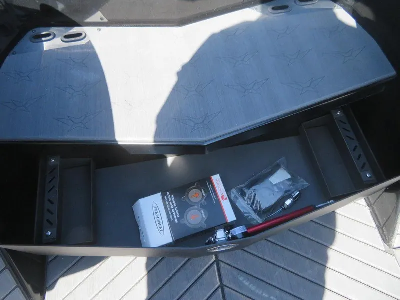 Slide: The Image of 2023 Vexus VX20 storage compartment with accessories and tools. - 21