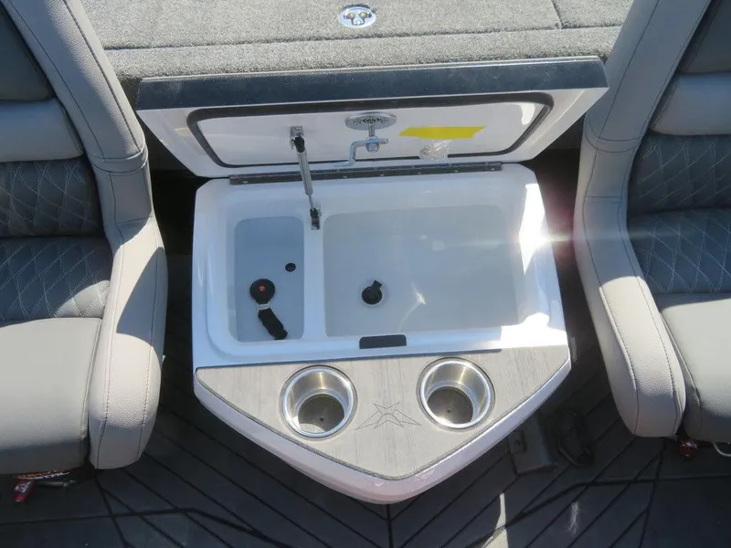 Slide: The Image of 2023 Vexus VX20 boat interior with open storage compartment and cup holders. - 23