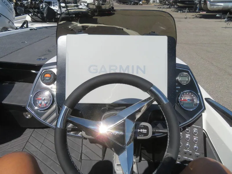 Slide: The Image of 2023 Vexus VX20 boat dashboard with Garmin navigation system and steering wheel. - 28